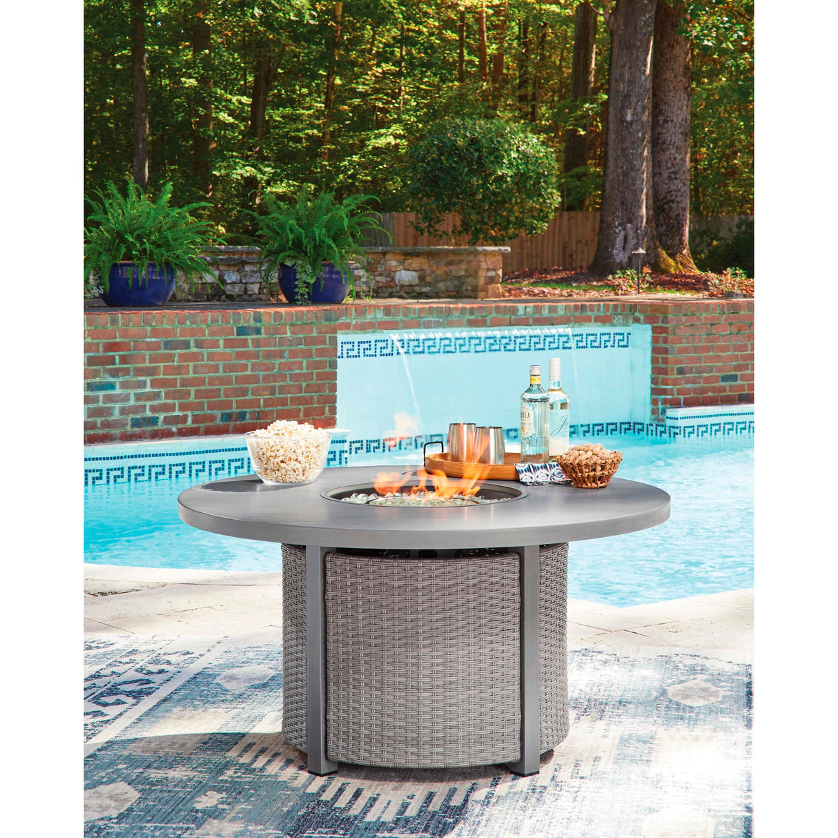Signature Design by Ashley Half Moon Beach PCP418-776 Round Fire Pit Table IMAGE 5