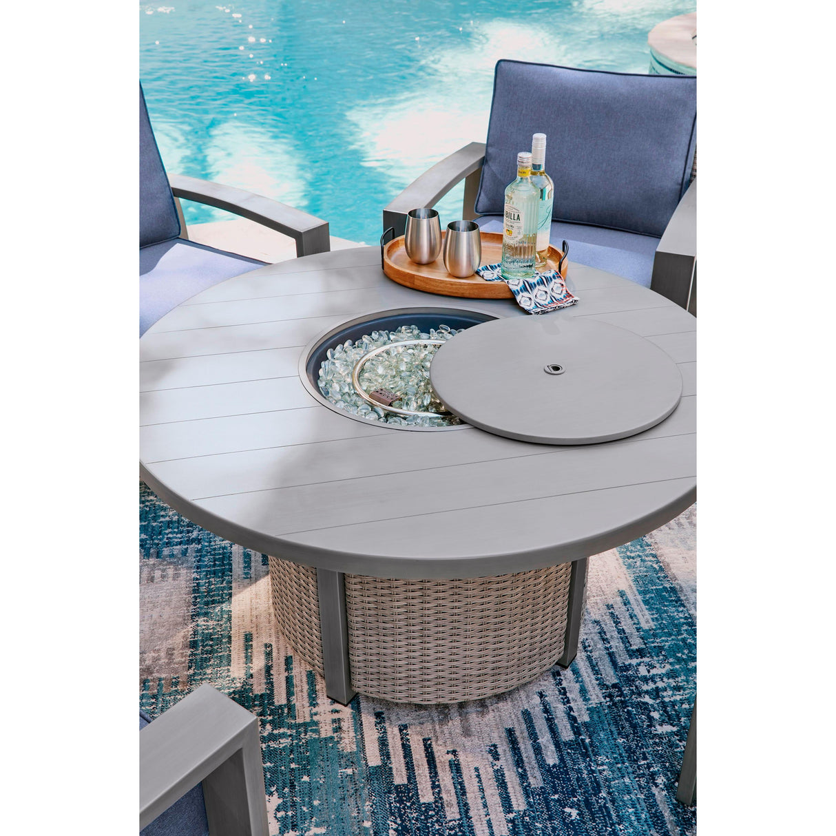 Signature Design by Ashley Half Moon Beach PCP418-776 Round Fire Pit Table IMAGE 6